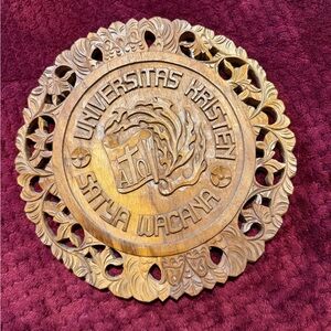 Intricate wooden wall plaque carving, the Satya Wacana Christian Uni,Indonesia.